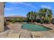 Inviting backyard pool area framed by palm trees, lush landscaping and a sunny sky at 5342 S Citrus Ct, Gilbert, AZ 85298