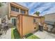 The backyard features artificial turf and a wooden shed, creating a low-maintenance outdoor space at 6304 N 47Th Ave, Glendale, AZ 85301