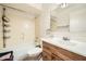 A clean bathroom featuring a tub-shower combo and a vanity with a white countertop at 6304 N 47Th Ave, Glendale, AZ 85301