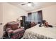 Comfortable bedroom featuring cozy chair and soft bedding, perfect for relaxing or sleeping at 6304 N 47Th Ave, Glendale, AZ 85301