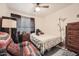 Comfortable bedroom featuring cozy chair and soft bedding, perfect for relaxing or sleeping at 6304 N 47Th Ave, Glendale, AZ 85301
