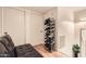 Hallway featuring a shoe rack and wooden floors, offering functional style at 6304 N 47Th Ave, Glendale, AZ 85301