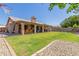 Spacious backyard with a covered patio and well-maintained landscaping, perfect for relaxation at 6357 W Potter Dr, Glendale, AZ 85308