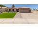 Beautiful single-Gathering home featuring a well-manicured lawn and an attached two-car garage at 6357 W Potter Dr, Glendale, AZ 85308