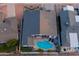 Aerial shot shows house with a private pool and a patio area, promoting a relaxing backyard space at 6450 E Vernon Ave, Scottsdale, AZ 85257