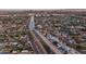 Expansive aerial view of the neighborhood with a canal running through, showcasing a vibrant community and nearby amenities at 6450 E Vernon Ave, Scottsdale, AZ 85257
