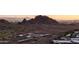 A beautiful view of a local mountain with the city landscape and schools below at 6450 E Vernon Ave, Scottsdale, AZ 85257