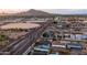 Aerial view of the neighborhood with houses and a community pool, highlighting a relaxed atmosphere and local amenities at 6450 E Vernon Ave, Scottsdale, AZ 85257