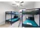 Shared ' bedroom with bunk beds, ceiling fan, and natural light provide functional space at 6450 E Vernon Ave, Scottsdale, AZ 85257
