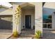 Modern home entrance with beautiful paver walkway and desert flora providing a welcoming pathway at 6450 E Vernon Ave, Scottsdale, AZ 85257