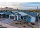 Contemporary home featuring a well-manicured desert landscape and mountain views at 6450 E Vernon Ave, Scottsdale, AZ 85257