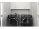 Convenient laundry room featuring side by side Samsung washer and dryer at 6450 E Vernon Ave, Scottsdale, AZ 85257