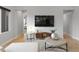 Comfortable living room with stylish decor, including a large TV and contemporary furniture at 6450 E Vernon Ave, Scottsdale, AZ 85257