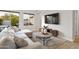 Bright living room with a plush sectional sofa and stylish decor at 6450 E Vernon Ave, Scottsdale, AZ 85257