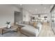 Bright, open-concept living room featuring a modern kitchen and cozy seating area at 6450 E Vernon Ave, Scottsdale, AZ 85257