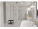 Serene main bathroom with soaking tub, glass shower, and modern vanity create a relaxing retreat at 6450 E Vernon Ave, Scottsdale, AZ 85257