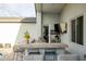 The outdoor bar area is a backyard paradise, featuring comfortable seating and a TV at 6450 E Vernon Ave, Scottsdale, AZ 85257
