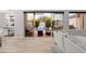 Inviting view from the living room to the outdoor patio with pool and fire pit at 6450 E Vernon Ave, Scottsdale, AZ 85257