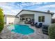 Inviting backyard featuring a refreshing pool, poolside lounge chairs, and a covered outdoor bar area, perfect for relaxation at 6450 E Vernon Ave, Scottsdale, AZ 85257