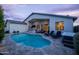 Serene backyard oasis with a sparkling pool, comfortable lounge chairs, and a convenient bar area for outdoor relaxation at 6450 E Vernon Ave, Scottsdale, AZ 85257