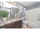Beautiful bathroom with a granite countertop vanity, matching backsplash, and a shower/tub combo at 6611 S San Jacinto St, Gilbert, AZ 85298