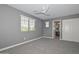 This spacious bedroom features soft gray walls, plush carpeting, and an ensuite bathroom at 6611 S San Jacinto St, Gilbert, AZ 85298