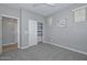 Bedroom featuring neutral walls, plush carpeting, closet, and a bright window with views of the outdoors at 6611 S San Jacinto St, Gilbert, AZ 85298