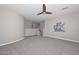 Spacious bonus room with carpeted floor, ceiling fan and plenty of natural light at 6611 S San Jacinto St, Gilbert, AZ 85298