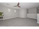 Spacious bonus room with carpeted floor, ceiling fan and plenty of natural light at 6611 S San Jacinto St, Gilbert, AZ 85298