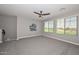 Spacious bonus room with carpeted floor, ceiling fan and plenty of natural light at 6611 S San Jacinto St, Gilbert, AZ 85298