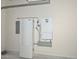 Clean garage featuring solar panel equipment and home battery storage system at 6611 S San Jacinto St, Gilbert, AZ 85298