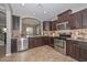 Stylish kitchen with granite countertops, stainless steel appliances, and tile backsplash at 6611 S San Jacinto St, Gilbert, AZ 85298