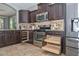 Kitchen features pull-out storage and stainless appliances, offering both style and functionality at 6611 S San Jacinto St, Gilbert, AZ 85298
