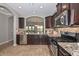 Charming kitchen boasts granite countertops, stainless appliances, and neutral color scheme at 6611 S San Jacinto St, Gilbert, AZ 85298