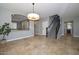 Bright living space with tile floors, staircase, and open view to the kitchen at 6611 S San Jacinto St, Gilbert, AZ 85298