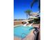Resort-style pool featuring water slides, set against a desert landscape and clear blue sky at 6611 S San Jacinto St, Gilbert, AZ 85298