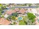 Aerial view of a sprawling estate featuring a sparkling pool, outdoor living spaces, and lush landscaping at 700 N Dobson Rd # 34, Chandler, AZ 85224