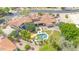 Overhead shot featuring a pool, tile roof, patio area, and mature trees surrounding the property at 700 N Dobson Rd # 34, Chandler, AZ 85224