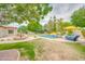 This backyard features a pristine pool, lush landscaping, and an elegant water feature, perfect for outdoor relaxation at 700 N Dobson Rd # 34, Chandler, AZ 85224