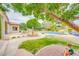 This backyard features a pristine pool, lush landscaping, and an elegant water feature, perfect for outdoor relaxation at 700 N Dobson Rd # 34, Chandler, AZ 85224