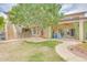 Lush backyard area featuring mature trees, stairs to upper level, outdoor seating and green lawn space at 700 N Dobson Rd # 34, Chandler, AZ 85224