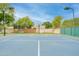 Basketball court with hoop is fenced in for safety and enjoyment on a well maintained surface at 700 N Dobson Rd # 34, Chandler, AZ 85224