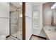 Bathroom with glass enclosed shower and decorative glass block window at 700 N Dobson Rd # 34, Chandler, AZ 85224