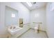 Bathroom features a tiled floor, sink, toilet, mirror, handicap railing, and dispenser at 700 N Dobson Rd # 34, Chandler, AZ 85224