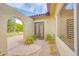 Charming courtyard entrance with brick pavers, garden space and arched doorway offers privacy and curb appeal at 700 N Dobson Rd # 34, Chandler, AZ 85224