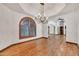 Dining room showcases arched window, hardwood flooring, and a modern chandelier at 700 N Dobson Rd # 34, Chandler, AZ 85224