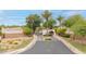 Welcoming community entrance featuring lush landscaping and palm trees at 700 N Dobson Rd # 34, Chandler, AZ 85224