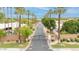 Gated community entrance featuring mature landscaping and a secure entry at 700 N Dobson Rd # 34, Chandler, AZ 85224