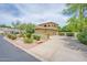 Well-maintained two-story home with desert landscaping, a tile roof, and a spacious driveway at 700 N Dobson Rd # 34, Chandler, AZ 85224