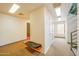 Hallway with a bench and coat hook has access to stairwell at 700 N Dobson Rd # 34, Chandler, AZ 85224